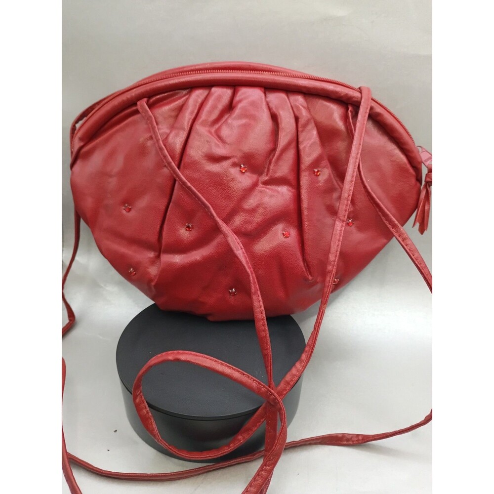 red leather crossbody bag with small gem accents